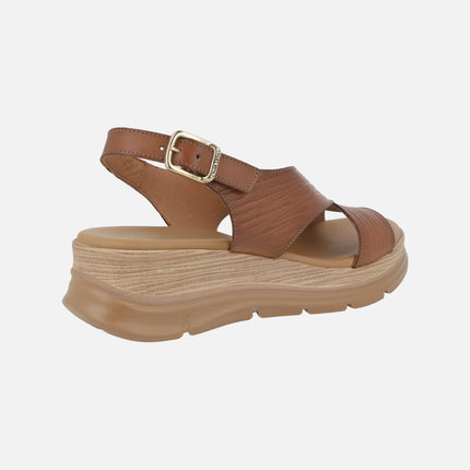 Brown leather sandals with heel strap and buckle