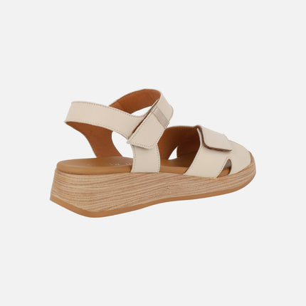 Leather sandals with low wedge and velcro closure