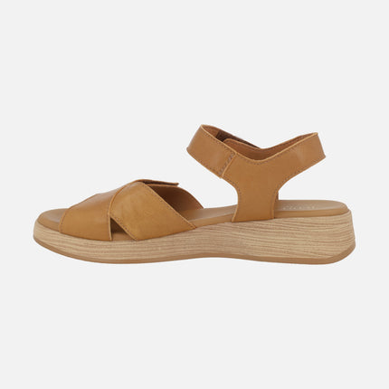 Leather sandals with low wedge and velcro closure