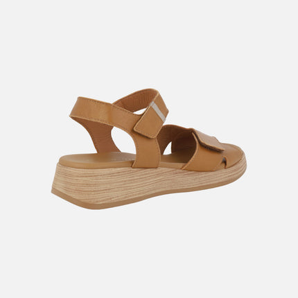 Leather sandals with low wedge and velcro closure