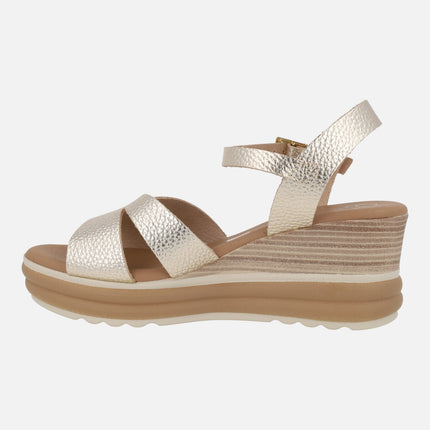 Wedge sandals in light gold metallic leather