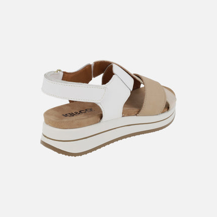Beige and white crossed strap sandals with velcro closure