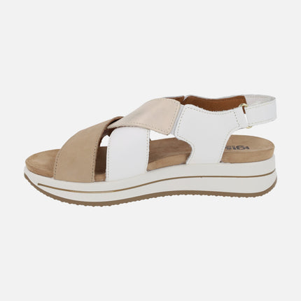Beige and white crossed strap sandals with velcro closure