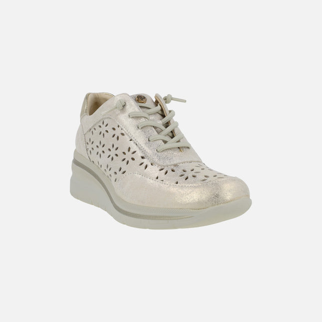 Die-cut sneakers in metallic gold with elastic laces