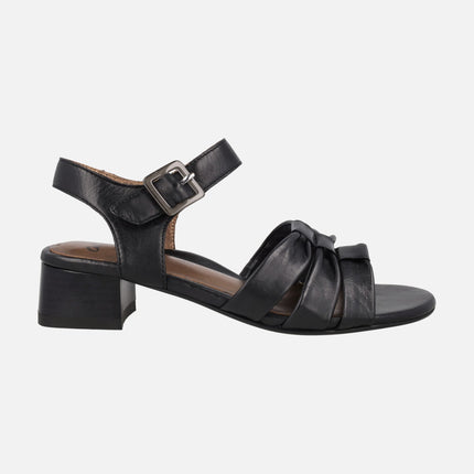 Black leather sandals with low heel and ankle bracelet