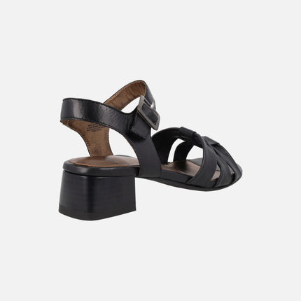 Black leather sandals with low heel and ankle bracelet