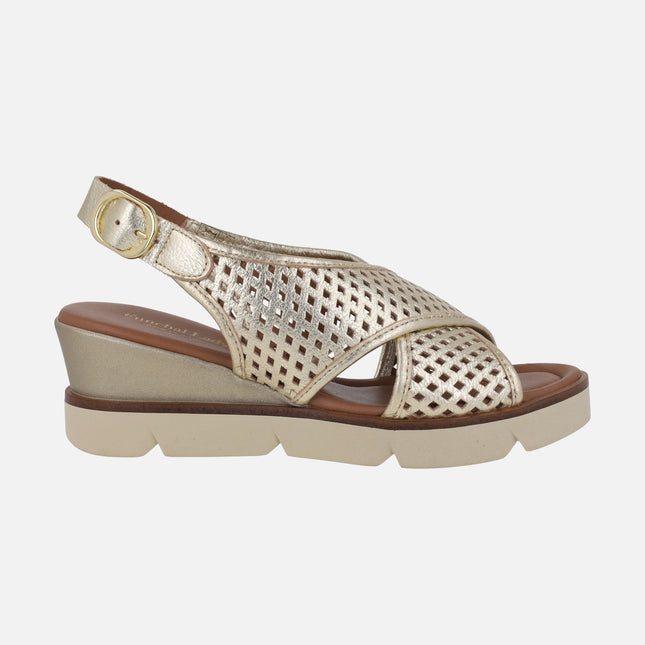 Metallic gold wedged sandals with perforations