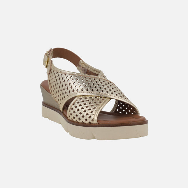 Metallic gold wedged sandals with perforations