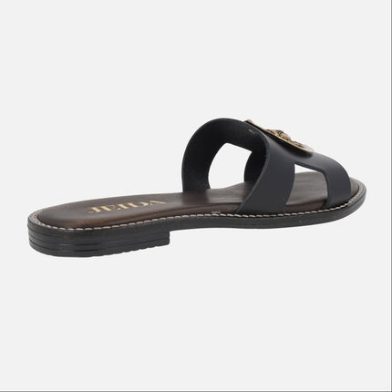 Sandalias planas de piel en color negro con adorno de sol dorado