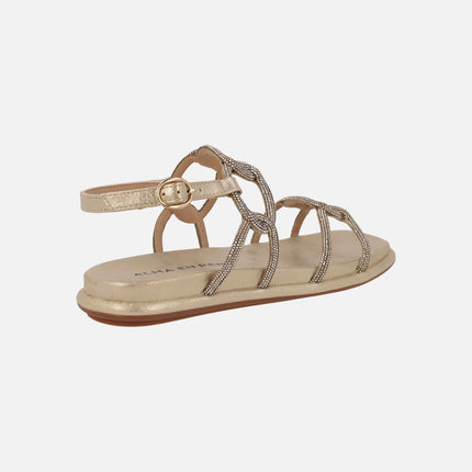 Sandalias doradas con eslabones de strass entrelazados