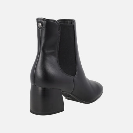 Black high-heeled ankle boots with elastic and zipper