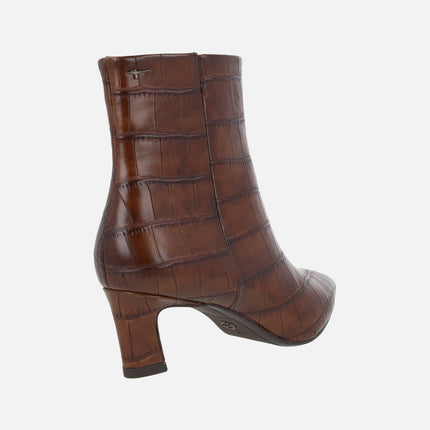 Women's heeled ankle boots in crocodile effect finish