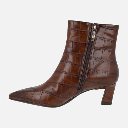 Women's heeled ankle boots in crocodile effect finish