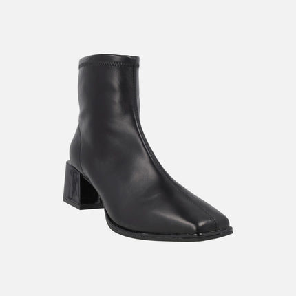 Black ankle boots in elastic leather-effect materials
