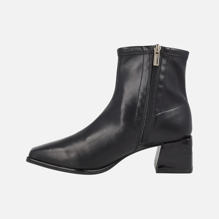 Black ankle boots in elastic leather-effect materials