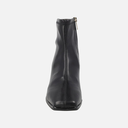 Black ankle boots in elastic leather-effect materials