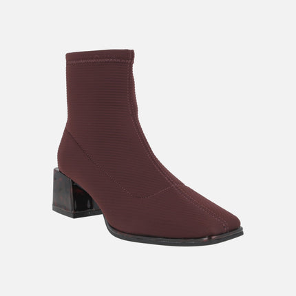 Ankle boots in elastic fabric with tortoiseshell effect heels