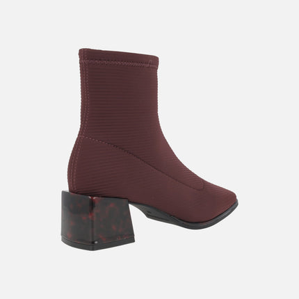Ankle boots in elastic fabric with tortoiseshell effect heels