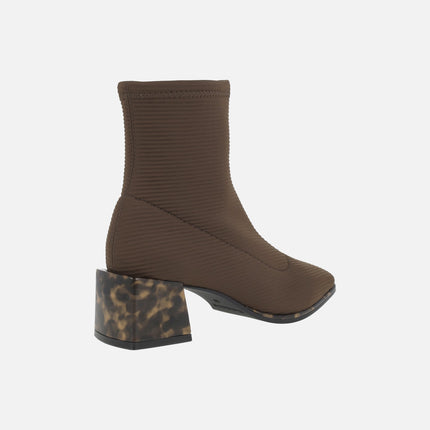 Ankle boots in elastic fabric with tortoiseshell effect heels