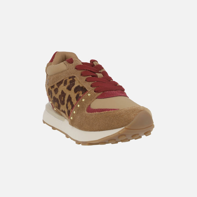 Sports sneakers with interior wedge in combined animal print