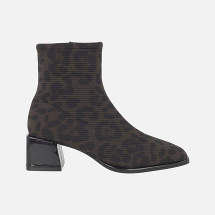 Heeled ankle boots in elastic animal print fabric