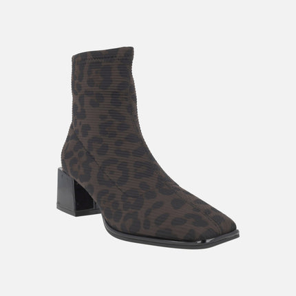 Heeled ankle boots in elastic animal print fabric