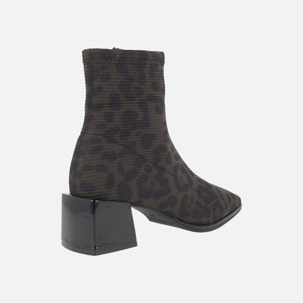 Heeled ankle boots in elastic animal print fabric