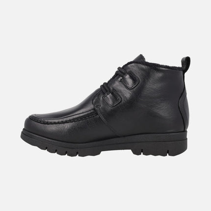 Botines de piel con forro de pelo y cierre de botones metálicos