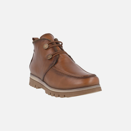 Botines de piel con forro de pelo y cierre de botones metálicos