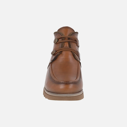 Botines de piel con forro de pelo y cierre de botones metálicos