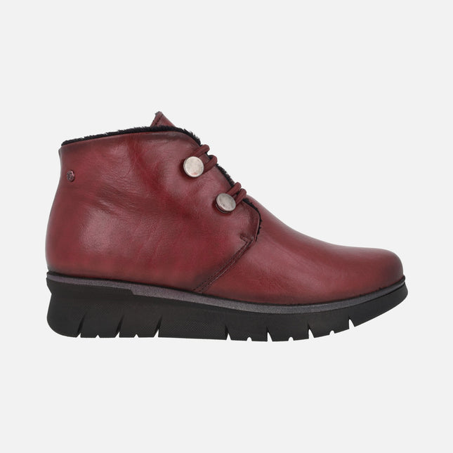 Botines confort en piel con elásticos y botones