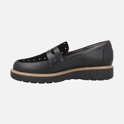 Black leather loafers with suede trim and studs