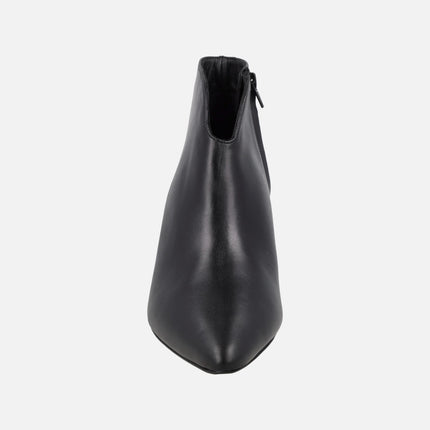 Women's high-heeled ankle boots in black leather with sharp toe