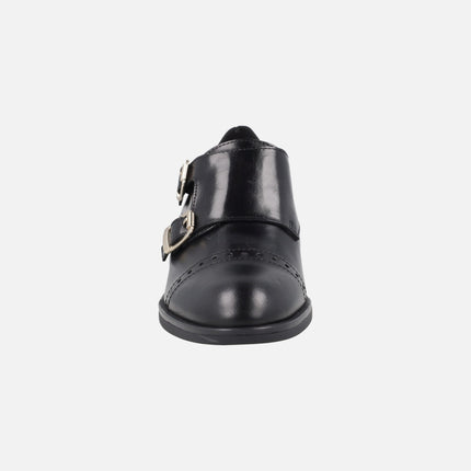 Zapatos para mujer en piel negra con hebillas doradas