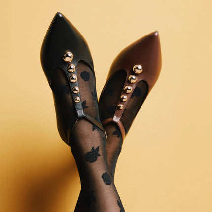 Leather ballerinas with strap crossing the instep and gold studs