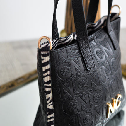 Bolsos estilo cubo en formato pequeño en negro y print cebra