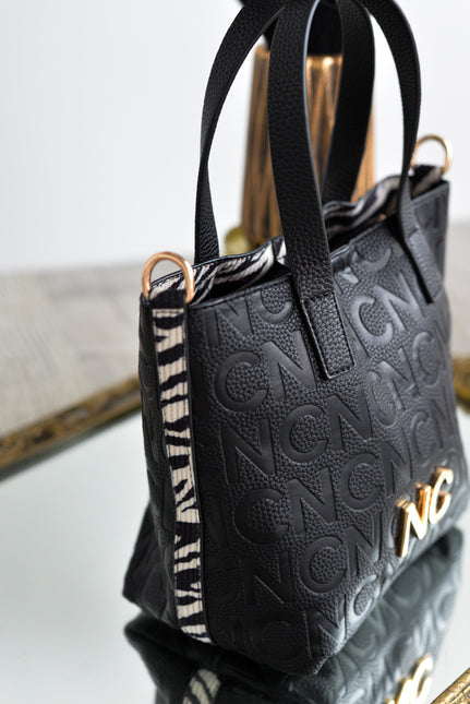 Bolsos estilo cubo en formato pequeño en negro y print cebra