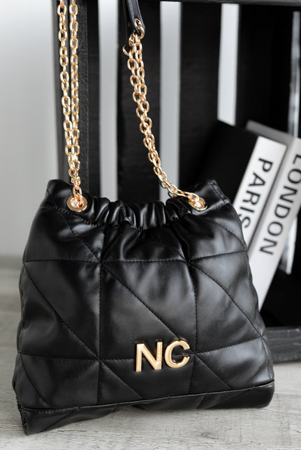 Bolsos tipo saco en acolchado negro con cadena