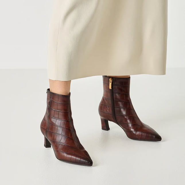 Women's heeled ankle boots in crocodile effect finish