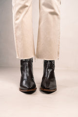 Cowboy tulum booties on wrinkled shine leather