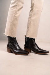 Cowboy tulum booties on wrinkled shine leather