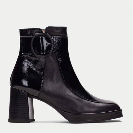 Black patent leather ankle boots with buckle ornament