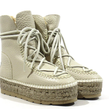 Raw leather boots with laces and yute platform