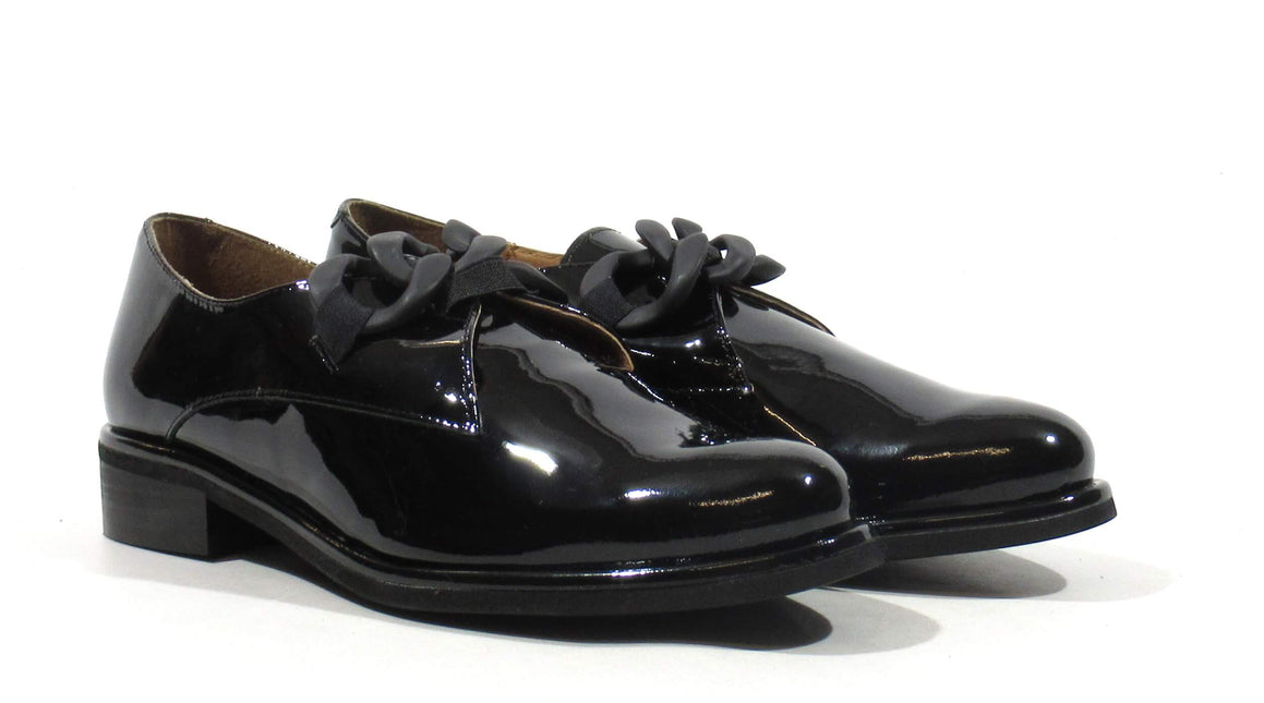 Black patent leather moccasins with chain ornament