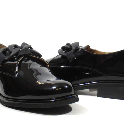 Black patent leather moccasins with chain ornament